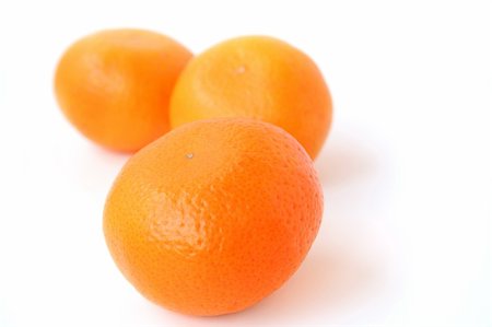 simsearch:400-04433511,k - three ripe delicious mandarines on a white background Stock Photo - Budget Royalty-Free & Subscription, Code: 400-04425781