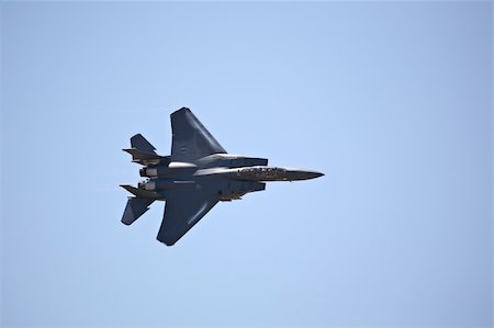 simsearch:400-04288052,k - F-15 strike eagle in flight against blue sky, banking hard right Stock Photo - Budget Royalty-Free & Subscription, Code: 400-04426399