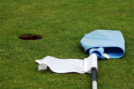 simsearch:400-03975619,k - golf green cutted grass, hole and blue flag post Stock Photo - Budget Royalty-Free & Subscription, Code: 400-04428096