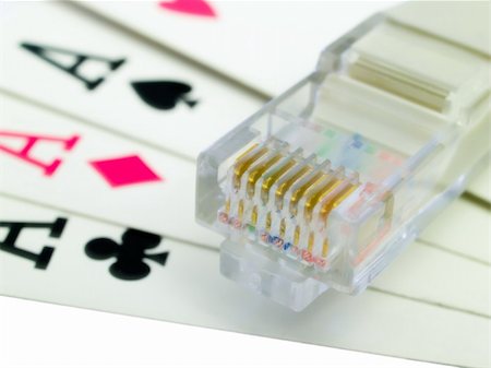 All the aces and a network cable representing online gambling. Stockbilder - Microstock & Abonnement, Bildnummer: 400-04428316