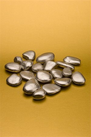 Silver pebbles against a gold background Stock Photo - Budget Royalty-Free & Subscription, Code: 400-04428567