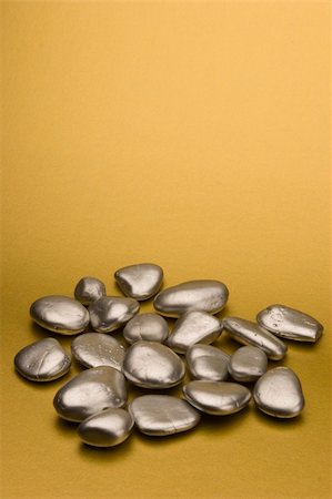 Silver pebbles against a gold background Stock Photo - Budget Royalty-Free & Subscription, Code: 400-04428569