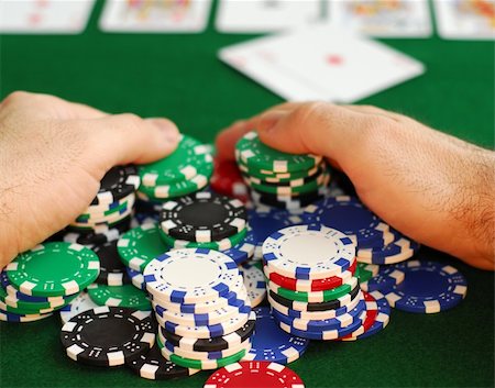 stake - Poker player raking a big pile of chips Stock Photo - Budget Royalty-Free & Subscription, Code: 400-04428765