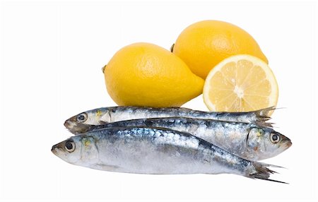 Close up off three sardines and lemons Stock Photo - Budget Royalty-Free & Subscription, Code: 400-04428768