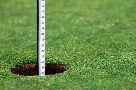simsearch:400-03975619,k - green grass course, hole with white post Stock Photo - Budget Royalty-Free & Subscription, Code: 400-04429081