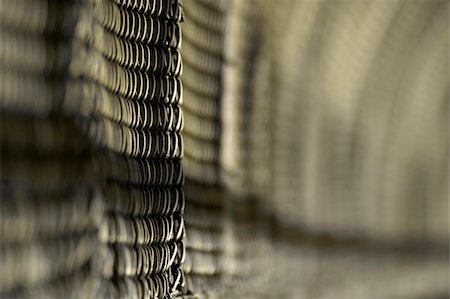 roundhouse - grey wired fence, distance blur, could be a construction site, or a jailhouse Stock Photo - Budget Royalty-Free & Subscription, Code: 400-04429514