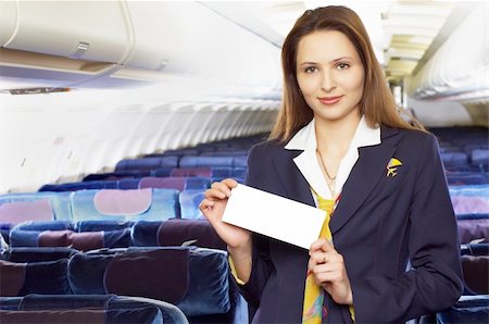 air hostess (stewardess) in the empty airliner cabin Stock Photo - Budget Royalty-Free & Subscription, Code: 400-04429590