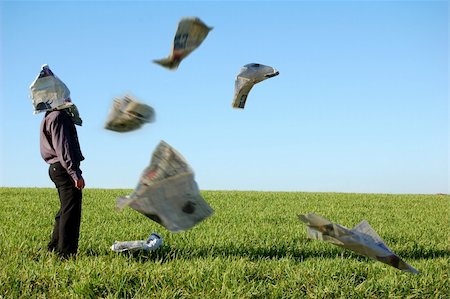 failure humour - A businessman with a newspaper flying around him. Stock Photo - Budget Royalty-Free & Subscription, Code: 400-04429694