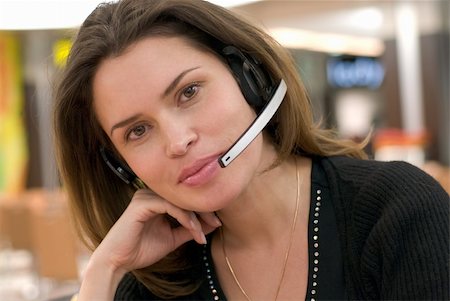 simsearch:400-04472832,k - Secretary in call center answering with handsfree Stock Photo - Budget Royalty-Free & Subscription, Code: 400-04429743