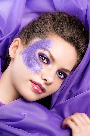 simsearch:400-04420197,k - face shot of a beauty model laying between purple fabrics showing her glitter make up Stock Photo - Budget Royalty-Free & Subscription, Code: 400-04420199