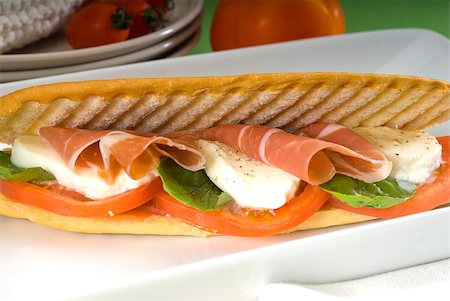 panini sandwich with fresh caprese and parma ham Stock Photo - Budget Royalty-Free & Subscription, Code: 400-04420452