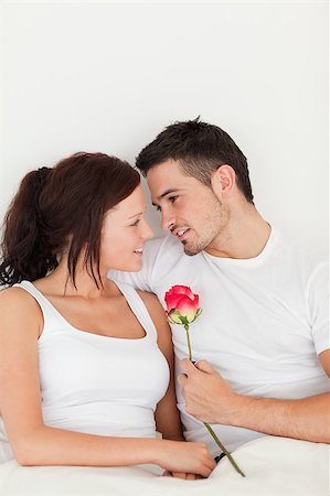 simsearch:400-04182849,k - Happy couple with a rose in the bedroom Stock Photo - Budget Royalty-Free & Subscription, Code: 400-04420817