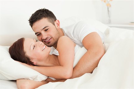 simsearch:400-04182849,k - Cheerful young couple in a bedroom Stock Photo - Budget Royalty-Free & Subscription, Code: 400-04420845
