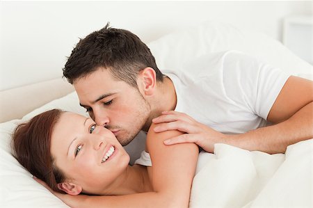 simsearch:400-04182849,k - Handsome Man kissing his wife on the cheek in the bedroom Stock Photo - Budget Royalty-Free & Subscription, Code: 400-04420849