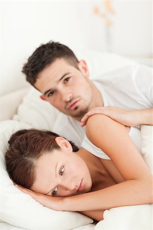 simsearch:400-04182849,k - Sad woman comforted by her husband in their bedroom Stock Photo - Budget Royalty-Free & Subscription, Code: 400-04420842