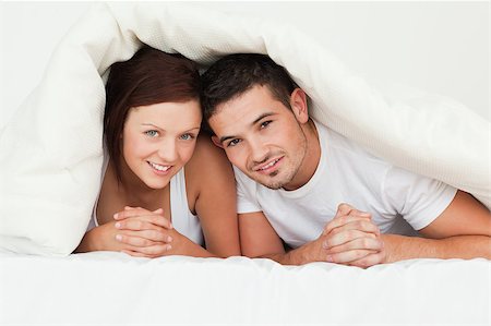 simsearch:400-04182849,k - Hiding couple in the bedroom Stock Photo - Budget Royalty-Free & Subscription, Code: 400-04420854