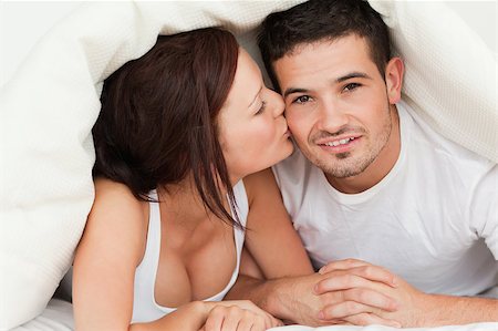 simsearch:400-04182849,k - Woman kissing man on the cheek in the bedroom Stock Photo - Budget Royalty-Free & Subscription, Code: 400-04420855