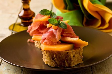 sweet and salty - photo of tasty bread slices with bacon and melon Stock Photo - Budget Royalty-Free & Subscription, Code: 400-04421388
