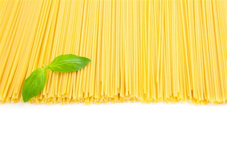 Italian cooking / spaghetti with basil / isolated on white Stock Photo - Budget Royalty-Free & Subscription, Code: 400-04421420