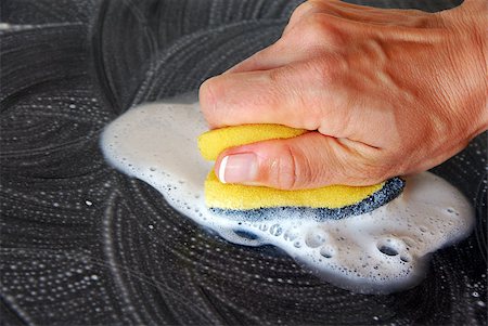 hand with a sponge cleaning surface in kitchen Stock Photo - Budget Royalty-Free & Subscription, Code: 400-04421497