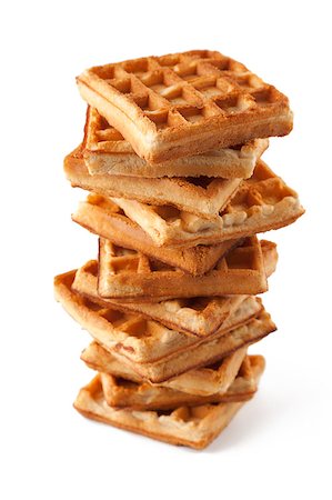 Big pile of fresh Belgian waffles on a white background Stock Photo - Budget Royalty-Free & Subscription, Code: 400-04421666