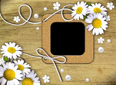 simsearch:400-05156538,k - Vintage photo frames and white daisies on an old, cracked background Fotografie stock - Microstock e Abbonamento, Codice: 400-04421713