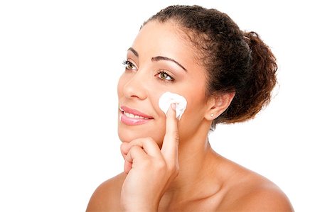 Beautiful face of young woman with hand applying exfoliating anti wrinkle cream beauty treatment for skincare, isolated. Stock Photo - Budget Royalty-Free & Subscription, Code: 400-04421756