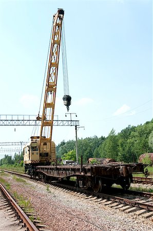 simsearch:400-04422019,k - Old Rail Track Mounted Crane with blue sky on background Fotografie stock - Microstock e Abbonamento, Codice: 400-04422019