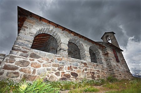 ssnowball (artist) - A small church in high mountain during summer with a cloudy sky Foto de stock - Super Valor sin royalties y Suscripción, Código: 400-04422066