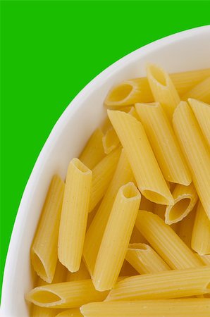simsearch:400-04341378,k - Close up of a dried italian pasta on green background Fotografie stock - Microstock e Abbonamento, Codice: 400-04422530