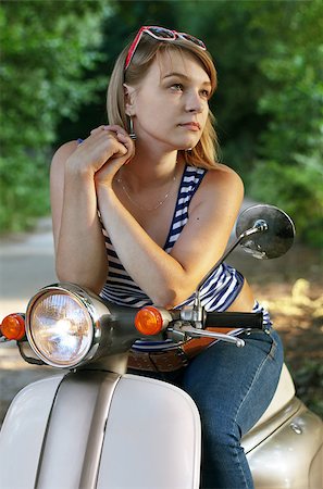 Portrait of young woman on scooter. Outdoor on street Photographie de stock - Aubaine LD & Abonnement, Code: 400-04423171