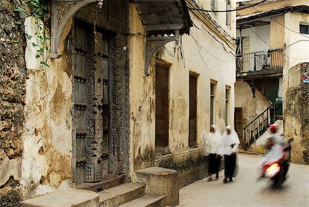 school and uniform and african - Motion photo of children on their way to school in Stone Town alleys, Zanzibar Island, World Heritage Site Stock Photo - Budget Royalty-Free & Subscription, Code: 400-04423582