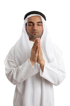 saudi arabian - Man wearing middle easter attire with hands together in quiet prayer. Stock Photo - Budget Royalty-Free & Subscription, Code: 400-04423650