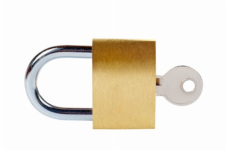 simsearch:400-04359676,k - Macro of a locked padlock with the key on it Stock Photo - Budget Royalty-Free & Subscription, Code: 400-04434038