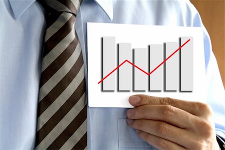 simsearch:400-05124201,k - Man in tie holding a paper with a graph. Stockbilder - Microstock & Abonnement, Bildnummer: 400-04434080