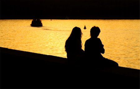 simsearch:400-05065940,k - Silhouette of Young Couple at Sunset Stock Photo - Budget Royalty-Free & Subscription, Code: 400-04434155