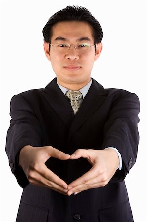 simsearch:400-06072872,k - Asian young guy with love shape gesture. Foto de stock - Royalty-Free Super Valor e Assinatura, Número: 400-04434181