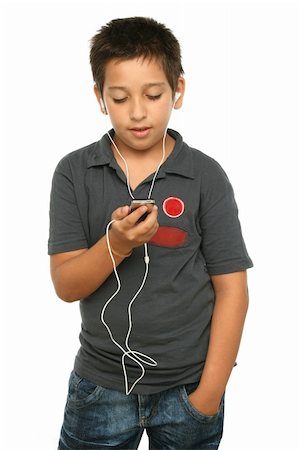 simsearch:400-04434331,k - Boy listening music with a mp4 player, white background Photographie de stock - Aubaine LD & Abonnement, Code: 400-04434316