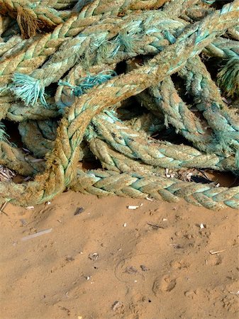 simsearch:633-02645546,k - Detail shot of old mooring rope lying on sand on a beach Stock Photo - Budget Royalty-Free & Subscription, Code: 400-04434699