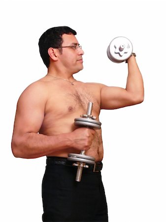 An muscles man is exercising with his dumbbells to stay in shape. Stock Photo - Budget Royalty-Free & Subscription, Code: 400-04434715