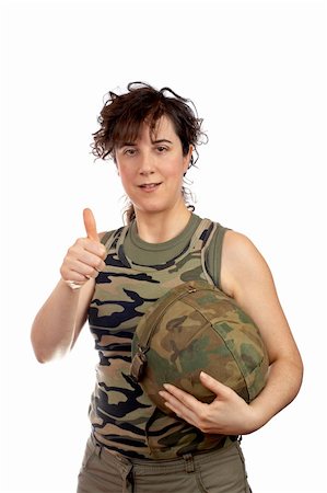 A beautiful soldier girl.  Success gesture and holding hard hat. Eyes on focus, finger out of focus Stock Photo - Budget Royalty-Free & Subscription, Code: 400-04434848