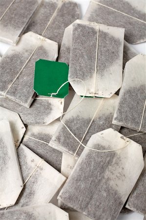 simsearch:400-06077206,k - Some tea bags with green label. Background vertical Photographie de stock - Aubaine LD & Abonnement, Code: 400-04434849