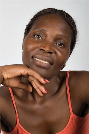 simsearch:400-06131658,k - Young african woman, Zimbabwe, no makeup, smiling Photographie de stock - Aubaine LD & Abonnement, Code: 400-04435067