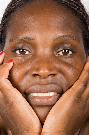 simsearch:400-06131658,k - Young african woman, Zimbabwe, no makeup, smiling Photographie de stock - Aubaine LD & Abonnement, Code: 400-04435068