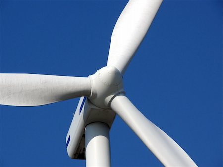 close-up portrait of wind turbine in blue sky Fotografie stock - Microstock e Abbonamento, Codice: 400-04435118