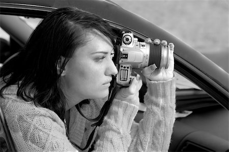 Girl shooting SLR photo camera Stock Photo - Budget Royalty-Free & Subscription, Code: 400-04435198