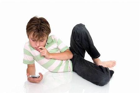simsearch:400-04434331,k - Child relaxing with electronic music player. Photographie de stock - Aubaine LD & Abonnement, Code: 400-04435205