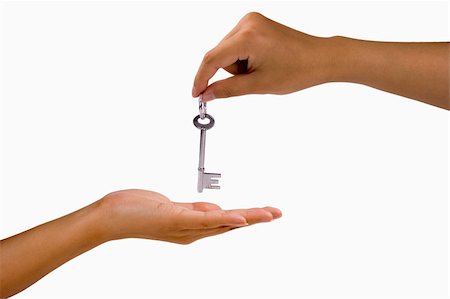 simsearch:400-04350998,k - Hand over a key in white isolated background. Stock Photo - Budget Royalty-Free & Subscription, Code: 400-04435210
