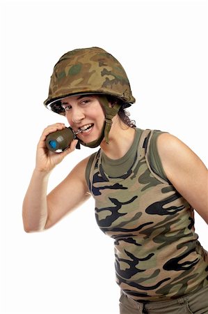 A beautiful soldier girl holding a hand grenade on white background Foto de stock - Super Valor sin royalties y Suscripción, Código: 400-04435231