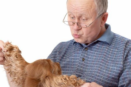 simsearch:400-04435288,k - Bald senior man with dog. Emotional portraits series. Isolated on white. Photographie de stock - Aubaine LD & Abonnement, Code: 400-04435284